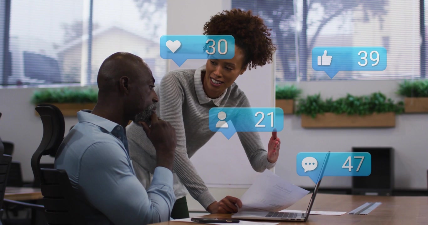 Woman leaning and man sitting presenting papers, sparking blue bubbles and showing growth