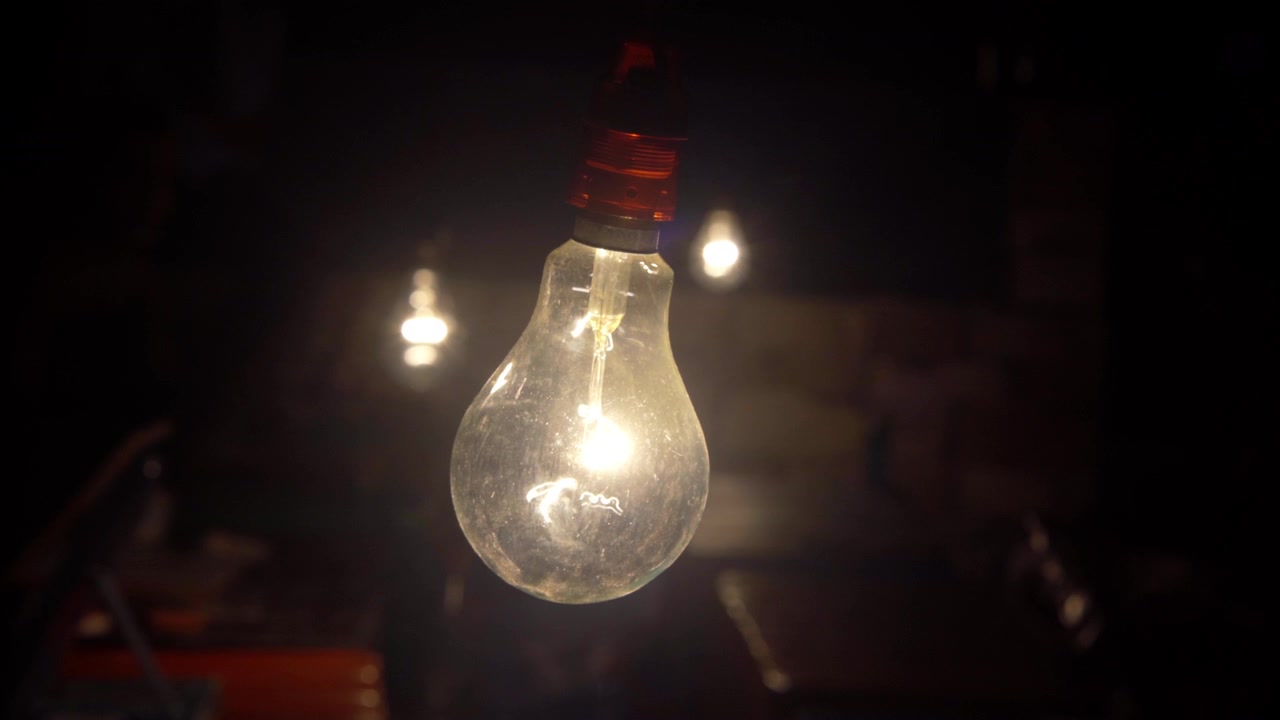 turning on-off iStock Decorative Antique Led Tungsten Light Bulbs Hanging On Ceiling