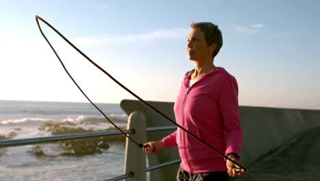 Mature-woman-exercising-with-jump-rope