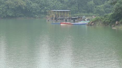 boats lying at boat station at massanjore dam at dumka in jharkhand, india