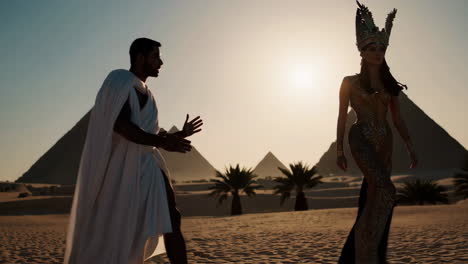 ancient egyptian couple in front of pyramids