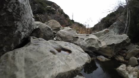 topanga canyon in california with fpv drone video moving forward above river