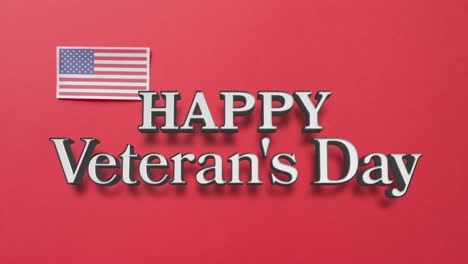 animation of veterans day text over flag of united states of america