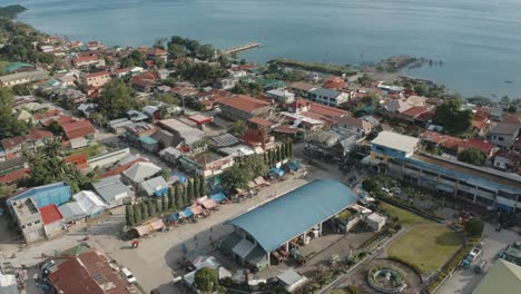 aerial view of coastal town and seashore in the philippines on a sunny summer day