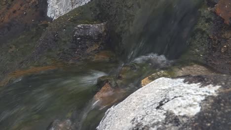 cascades flows on mossy rocks in boise national forest, idaho usa