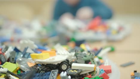 children building with plastic construction blocks