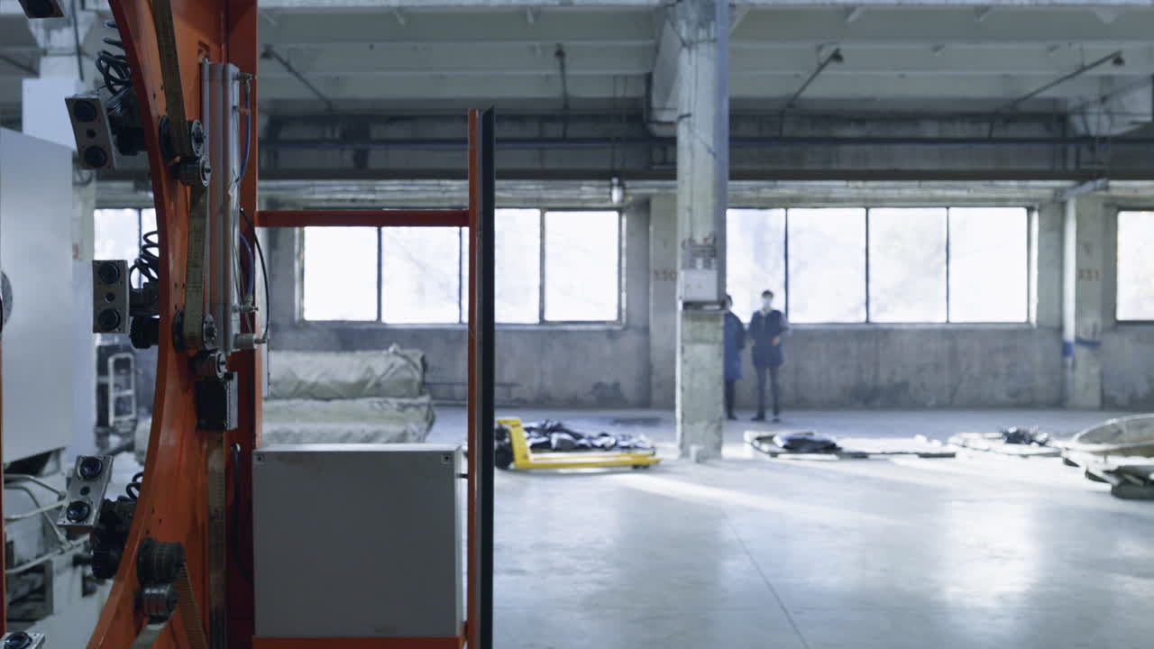 Closeup robotic tire machine moving at modern automotive workhouse facility