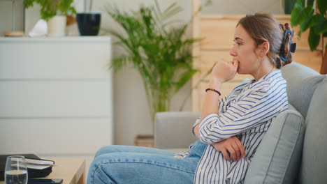 sad woman on sofa portrait