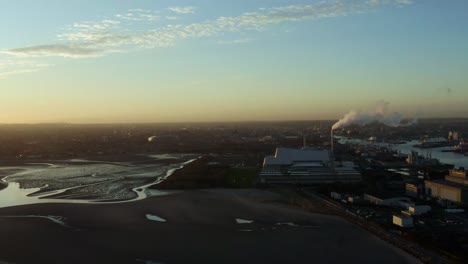 aerial of sandymount strand beach in ireland at sunset, truck left