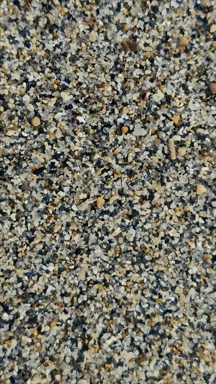 Vista Aproximada de Grãos de Areia de Praia Multicoloridos