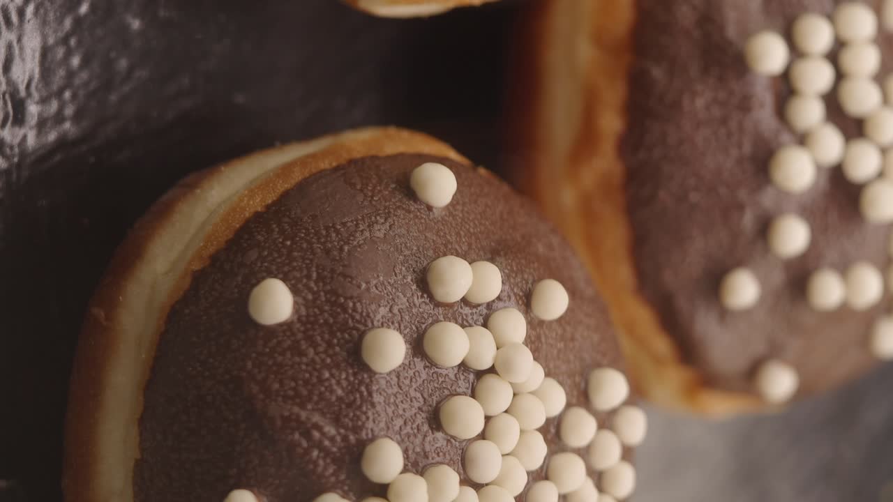 Chocolate Glazed Donuts with White Sprinkles