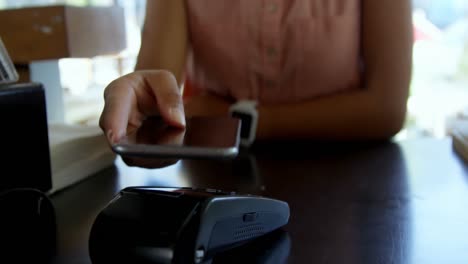 teenage girl making payment through nfc 4k