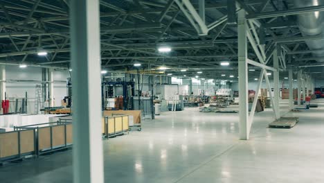 industrial production factory interior. storage space of a refrigeration factory with the staff in it