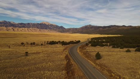 Great-Sand-Dunes-Mountain-Street-Sunset-Aerial-Pan-Shot-4K