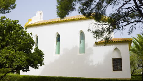 white chapel in a garden setting