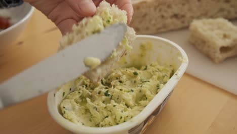 Typical-Madeiran-bread-bolo-do-caco-spread-with-butter-and-parsley