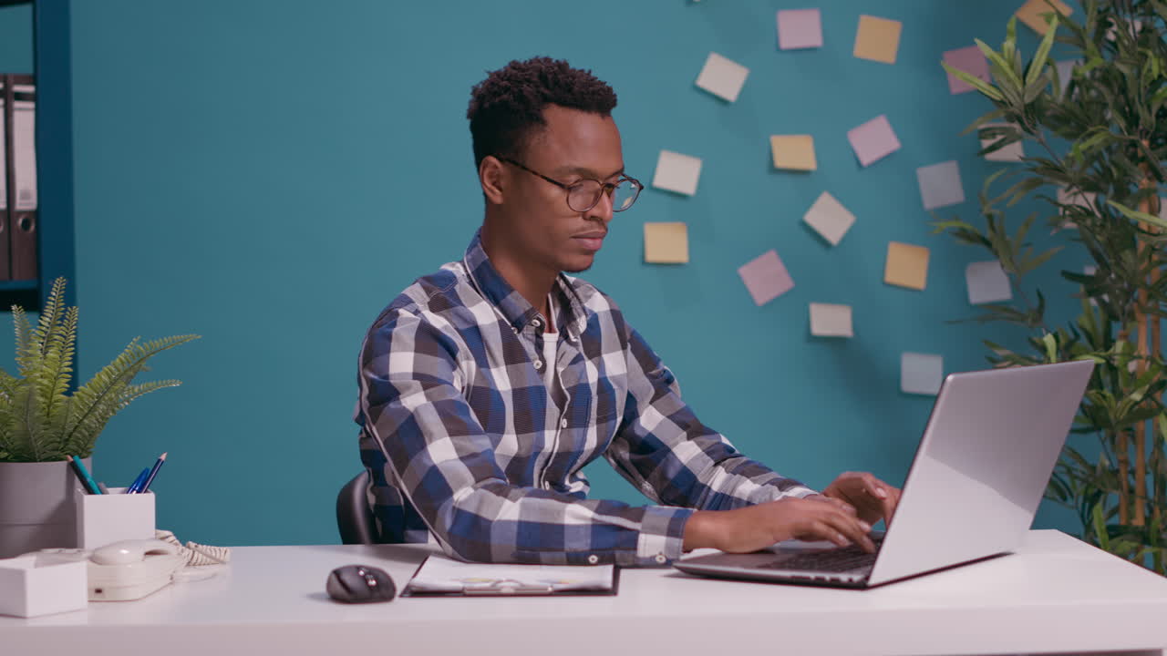 Desperate man yelling at laptop screen having work crisis