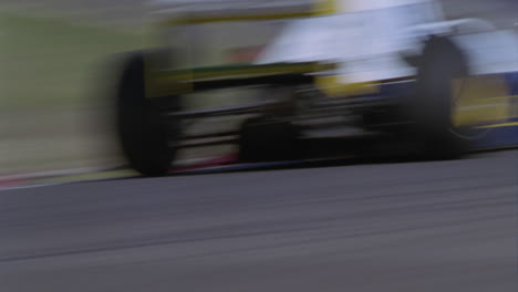 a race car takes a sharp turn on a track