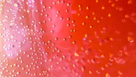 Macro-Abstract-Red-Bubbles-Sparkling-Blobs-into-Colorful-Bright-Fluid,-Creative-Background-Texture-Liquid-Art,-Light-Flare-Glare-Through-the-Liquid-Flow