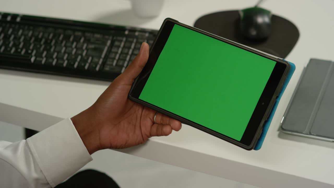 CU Man at Swipes on Tablet with Green Screen
