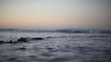 slow motion shallow depth of field shot of ripples in the ocean