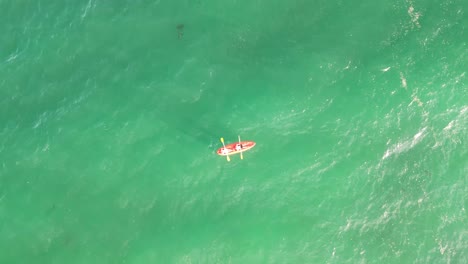 kayak-as-a-couple,-los-molles-beach,-located-in-the-region-of-valparaiso,-country-of-chile