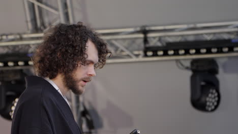 man giving a speech at a public event