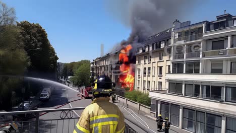 a building is on fire and the smoke is billowing out of the top of the building