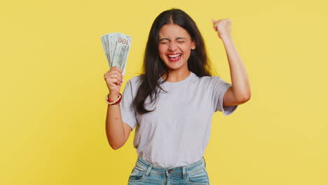 Rich-happy-Indian-woman-winner-waving-money-dollar-cash-like-a-fan,-income-wealth-success-business