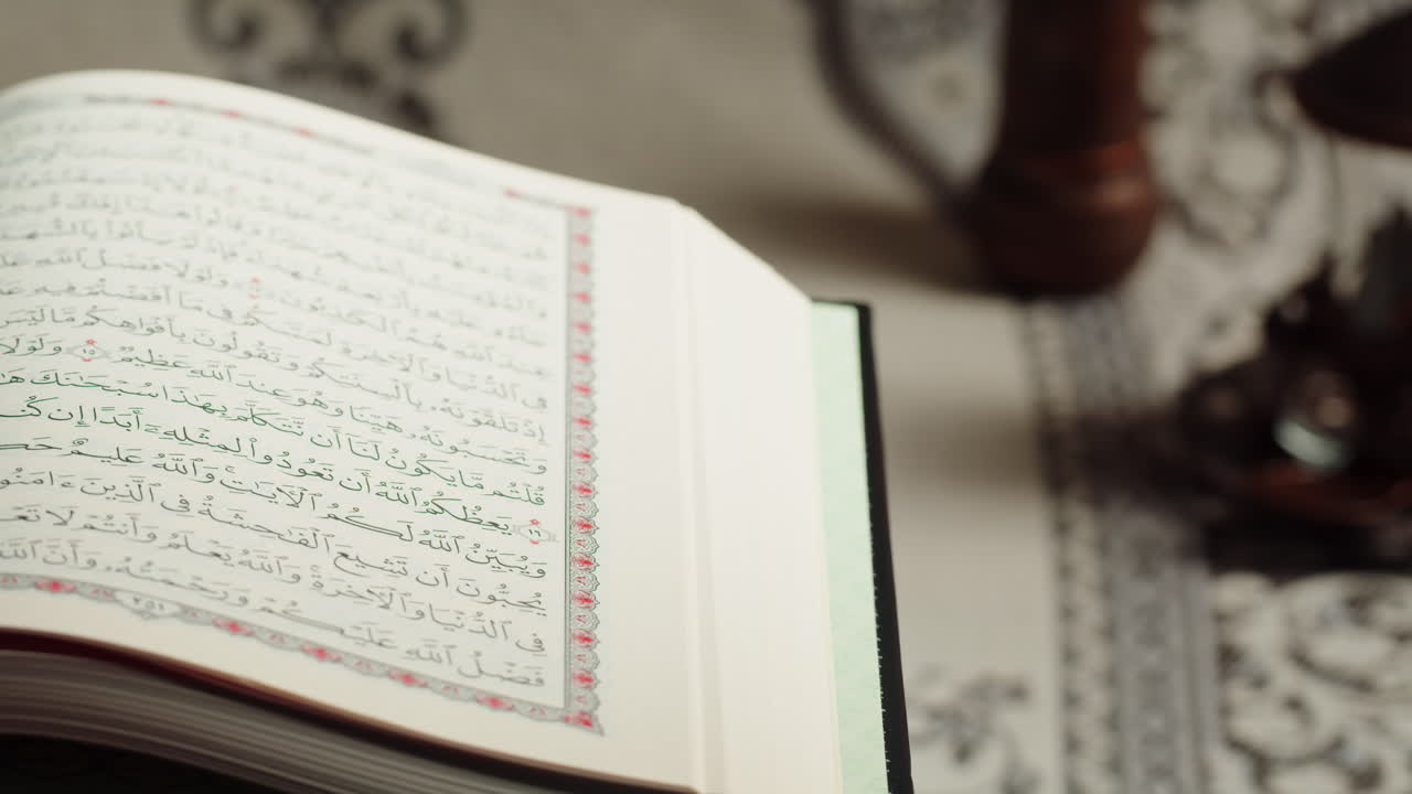 Quran book close-up, praying, islamic religion. Religious holiday Ramadan, holy month. Worship, making traditional prayer to God