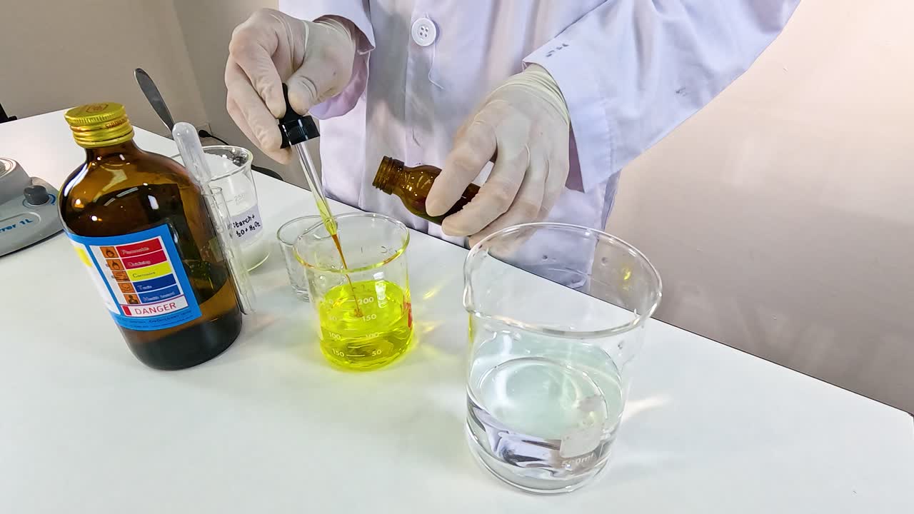 A scientist conducts an iodine clock reaction, mixing chemicals in a lab setting with precise measurements and controlled lighting