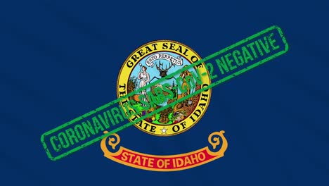 idaho us state swaying flag with green stamp of freedom from coronavirus, loop