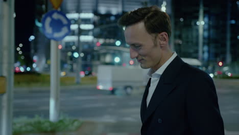 Sideview-of-a-confident-business-man-walking-on-road-during-night-time