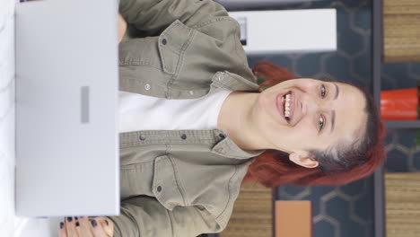 Vertical-video-of-Happy-and-cheerful-talking-business-woman-looking-at-camera.