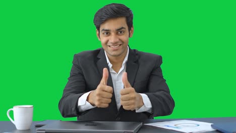 Happy-Indian-businessman-showing-thumbs-up-sign-Green-screen