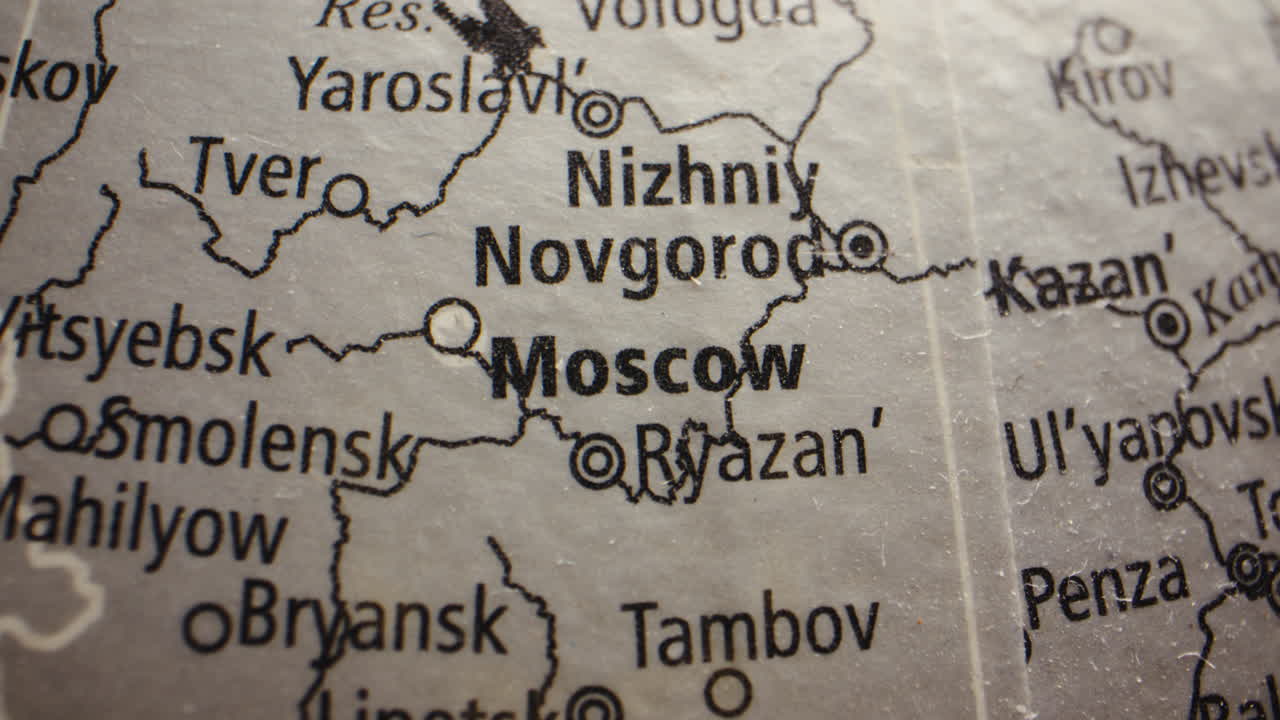 Close-up view of a map or globe showing cities in Russia, including Moscow