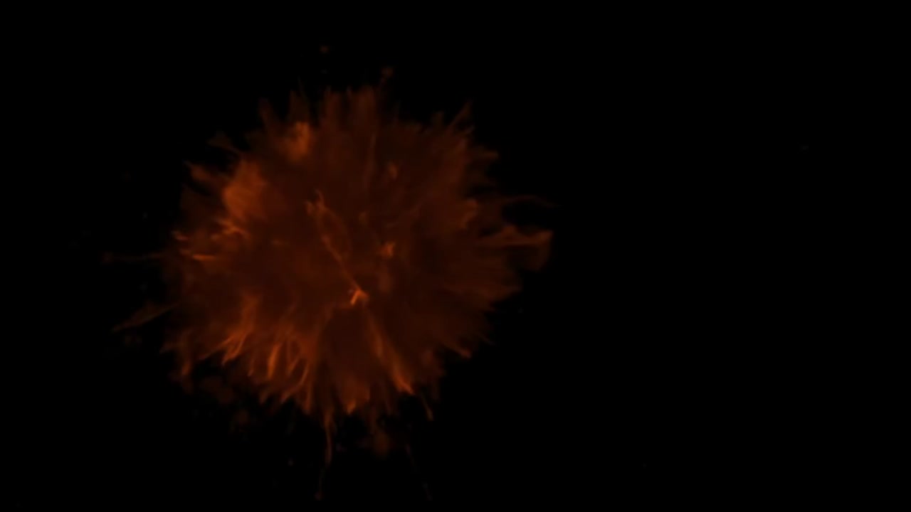un primer plano de polvo de color naranja salpicado en un fondo negro