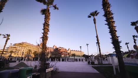 huge 5-star luxury holiday resort with palms, morning scenery