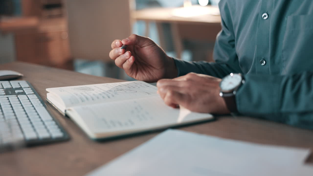 Business person, hands and writing in notebook