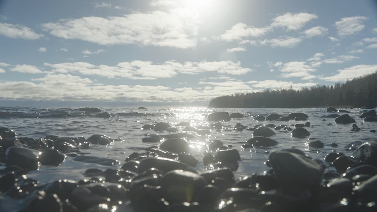 Lake Superior Coastline View Framed by Trees and Shoreline Vegetation