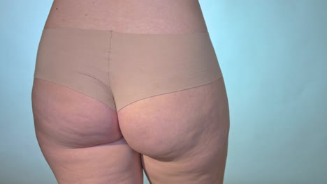 a woman in her underwear hit her hip to make it shake