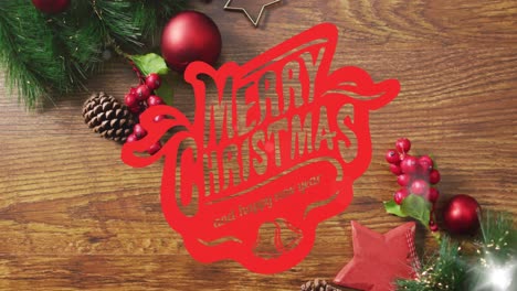 Animation-of-merry-christmas-text-over-decorations