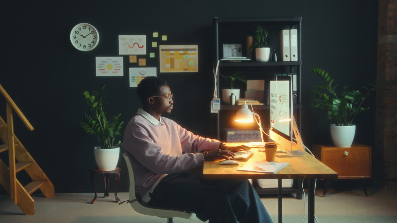 Young Black Businessman Entering Office and Working on Computer