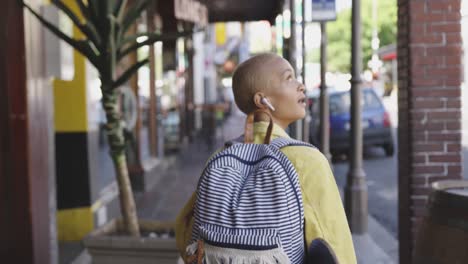 mixed race woman walking on street