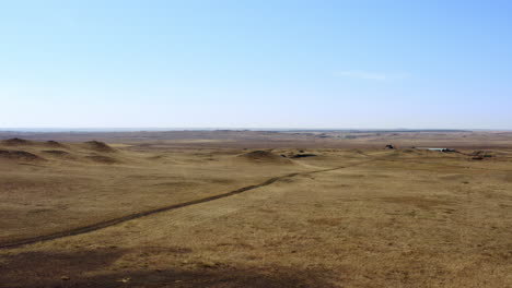 dry, dusty plainscape with dirt road