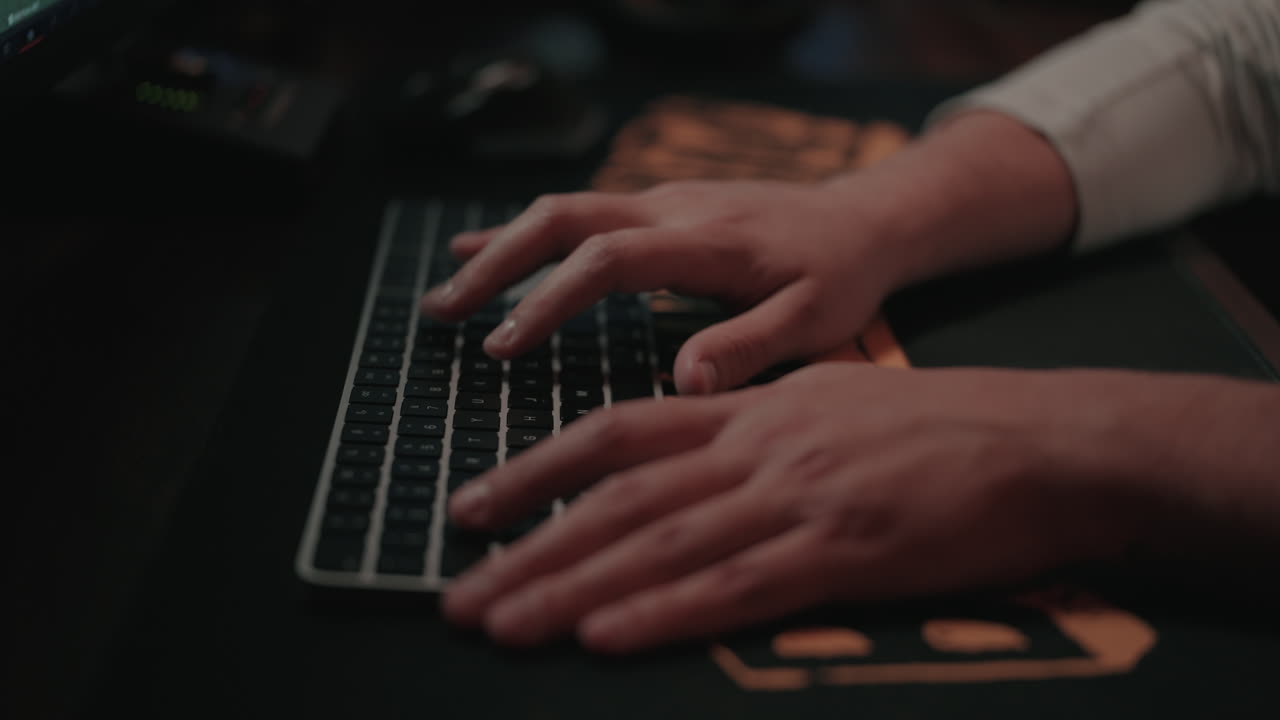 Person working on a computer at night