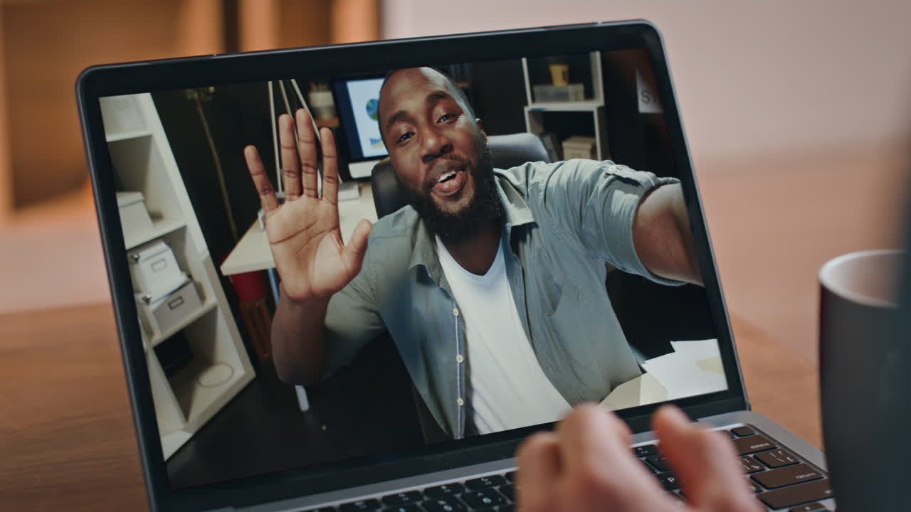 Man on a video call using a laptop