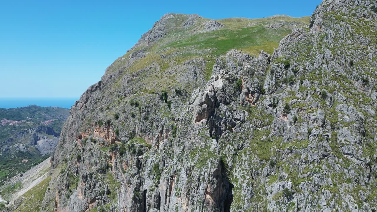 Aerial drone footage of Alcara Li Fusi, Sicily: mountain village, rocky peaks, lush valleys and wild Nebrodi landscapes. Ideal for travel, nature and scenic stock footage