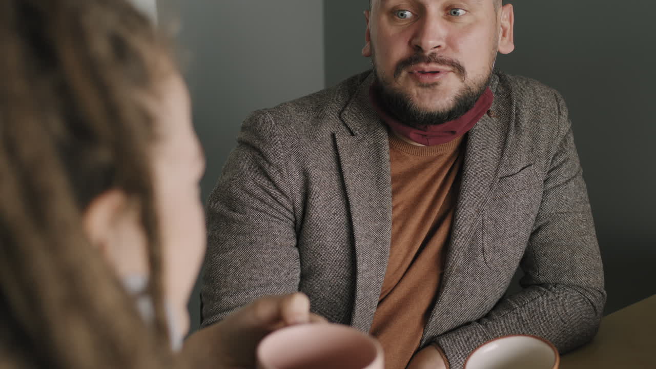 Colleagues Chatting in Office during Break