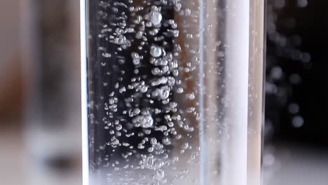bubbles rising in clear liquid